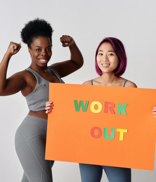Woman feeling energetic and happy during a light cardio workout in a bright studio.